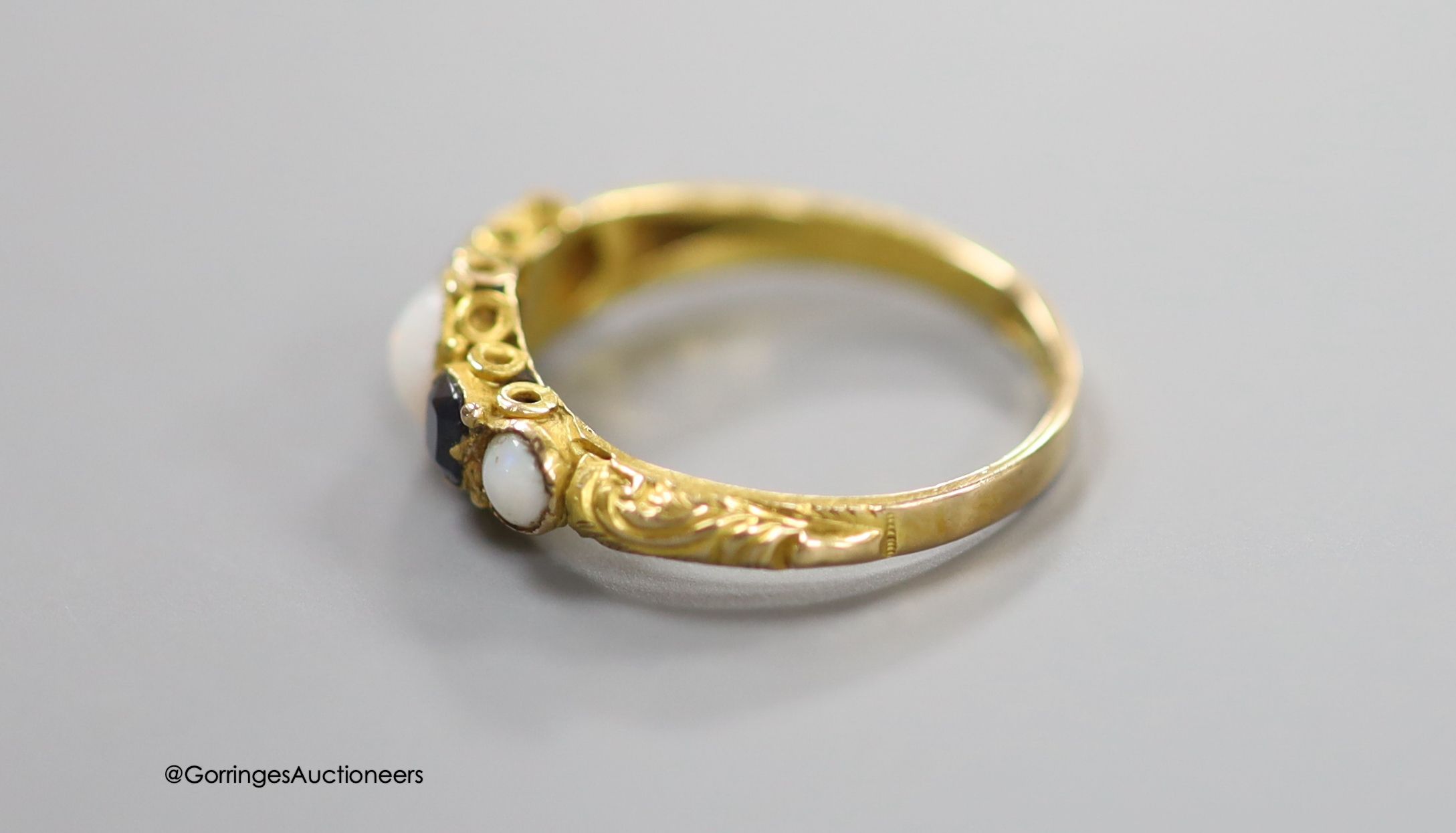 A Victorian 15ct gold, three stone white opal and two stone sapphire set half hoop ring, size L/M, gross 1.4 grams.